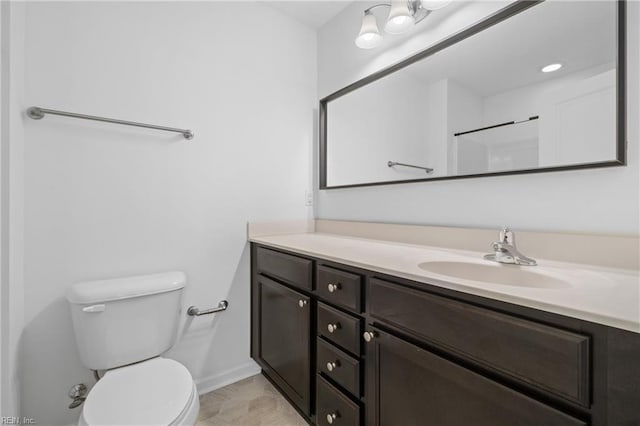 bathroom with toilet and vanity