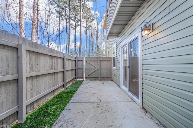 view of patio / terrace with a fenced backyard and a gate