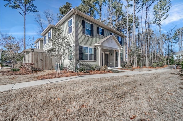 view of front of property featuring fence