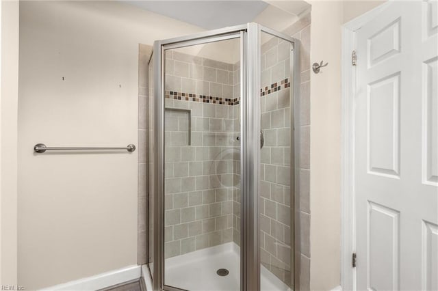 bathroom featuring a shower stall