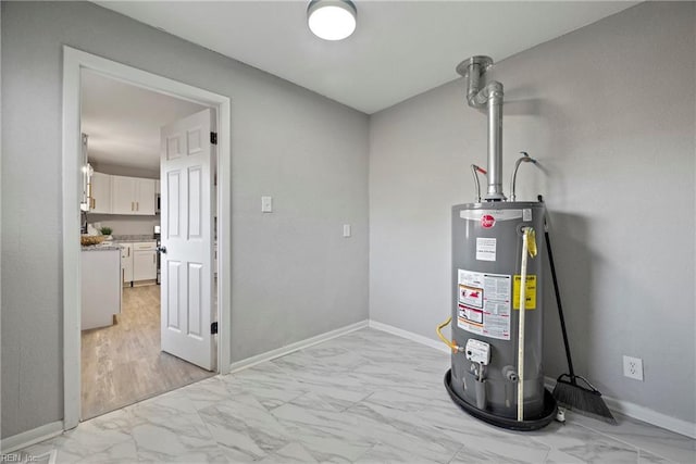 utility room with gas water heater