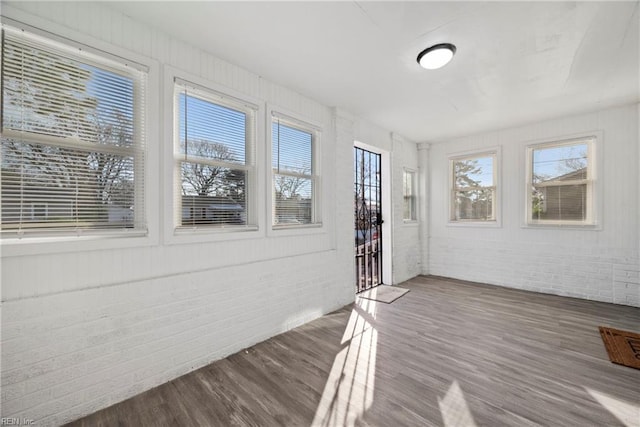 unfurnished sunroom featuring a healthy amount of sunlight