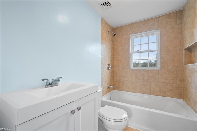 bathroom featuring toilet, shower / bath combination, visible vents, and vanity