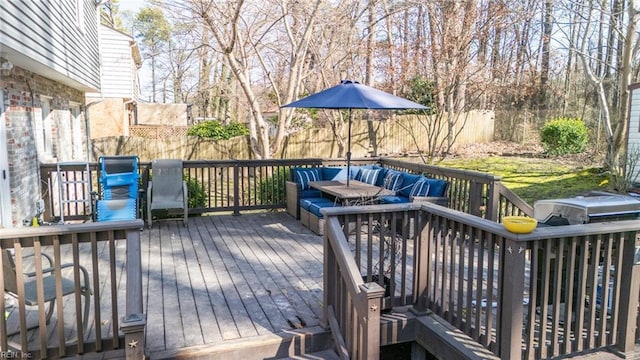 wooden terrace featuring a fenced backyard