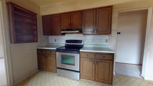 kitchen with wallpapered walls, stainless steel electric range, and under cabinet range hood