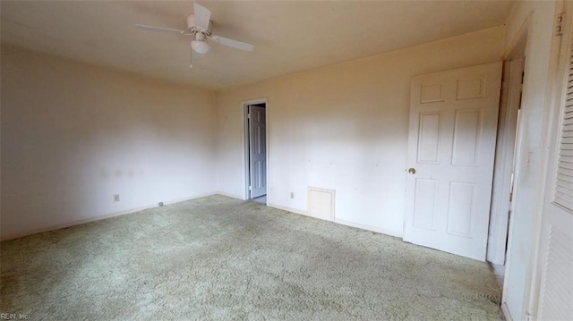 unfurnished bedroom featuring a ceiling fan and light carpet