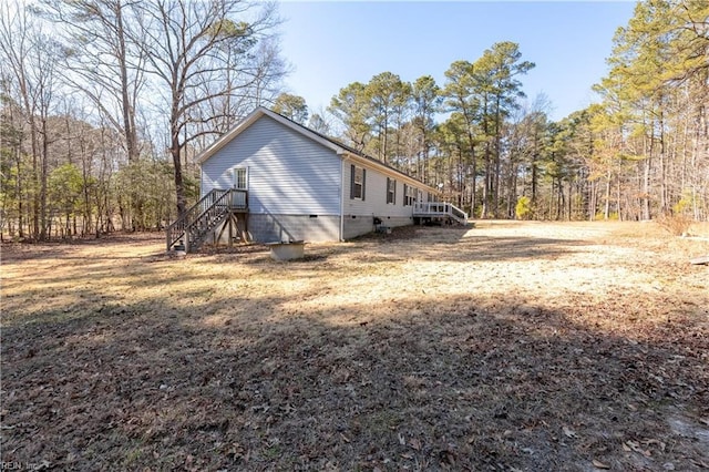 view of side of home featuring crawl space