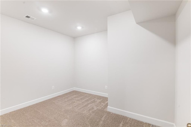 unfurnished room featuring carpet floors, recessed lighting, visible vents, and baseboards