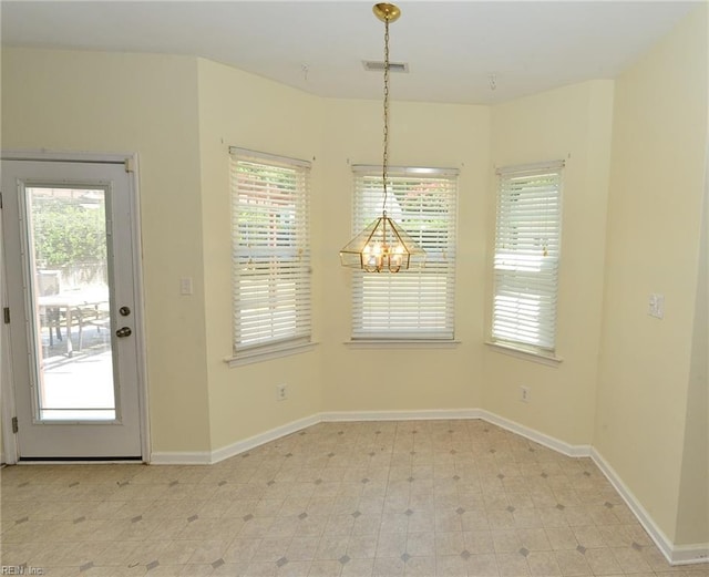 unfurnished dining area with light floors, baseboards, and visible vents