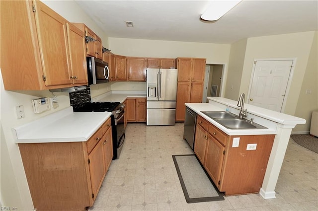 kitchen featuring a sink, visible vents, light countertops, appliances with stainless steel finishes, and light floors