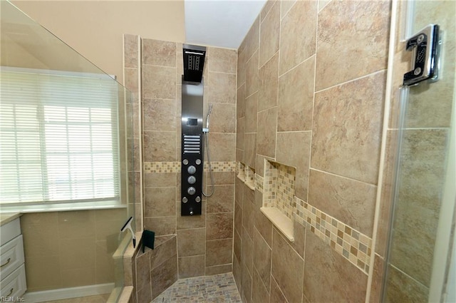 bathroom with a stall shower and vanity