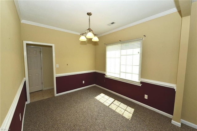 unfurnished room with dark colored carpet, visible vents, crown molding, and baseboards