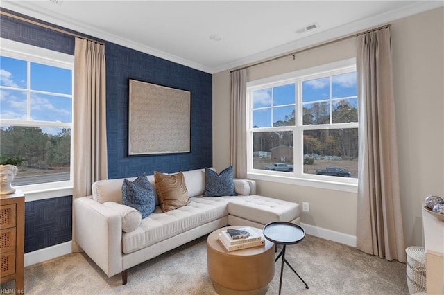 sitting room featuring carpet flooring, visible vents, crown molding, and baseboards