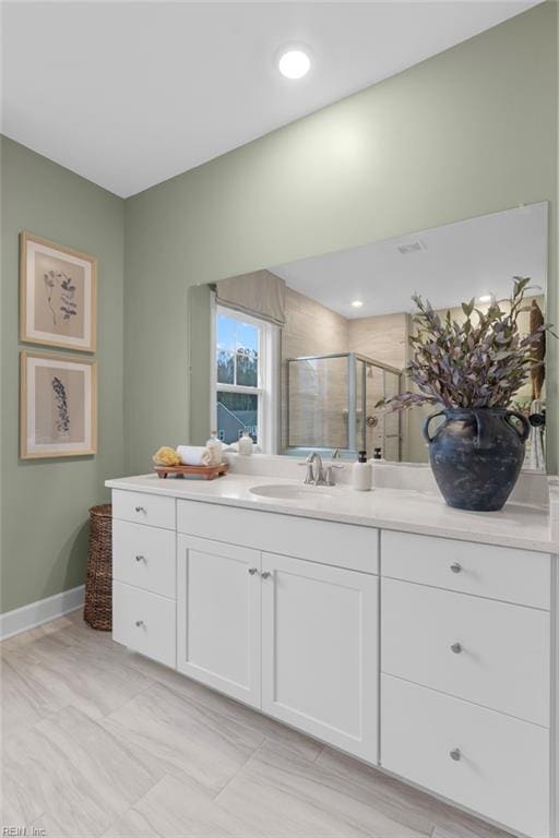 full bath featuring recessed lighting, baseboards, a shower stall, and vanity