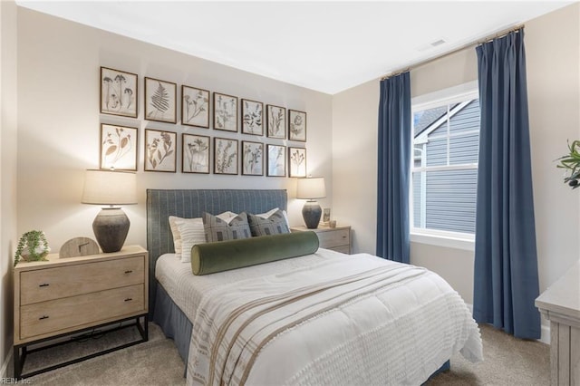 carpeted bedroom featuring visible vents