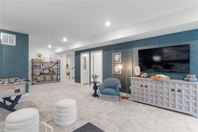 interior space featuring baseboards, an accent wall, visible vents, and recessed lighting