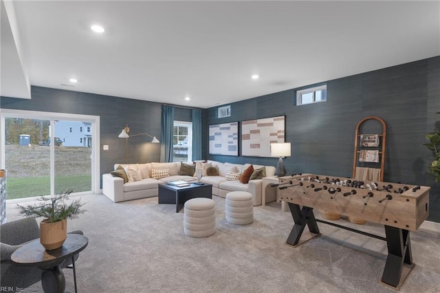 living room featuring light carpet, wallpapered walls, and recessed lighting