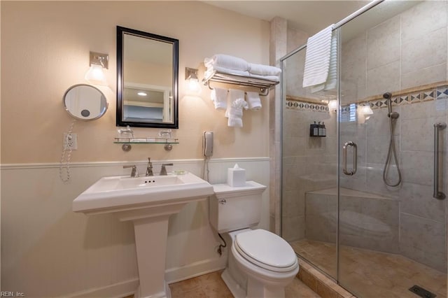 full bath with a shower stall and toilet