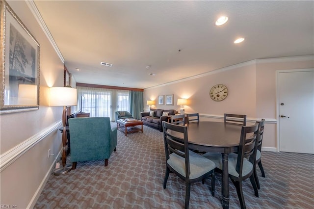 carpeted dining area with ornamental molding, recessed lighting, visible vents, and baseboards