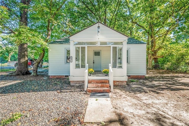 view of front of property with crawl space and covered porch