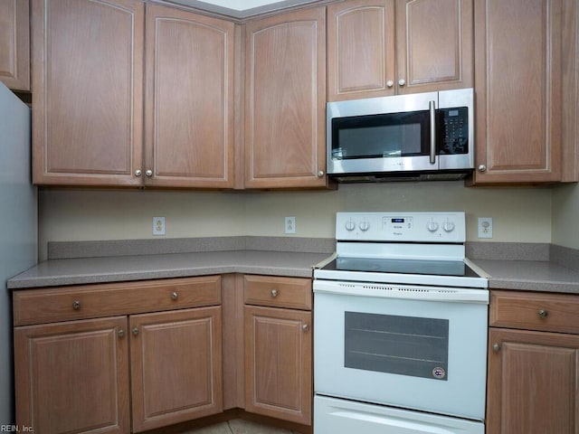 kitchen featuring light countertops and appliances with stainless steel finishes