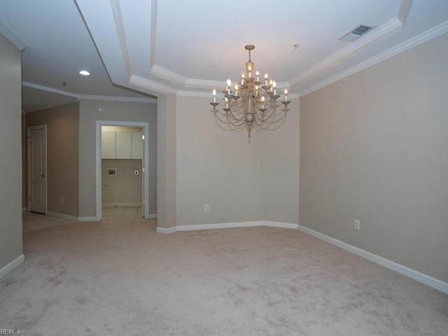 empty room with baseboards, ornamental molding, visible vents, and light colored carpet