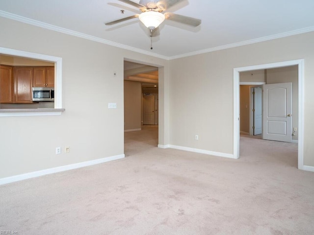 spare room featuring ornamental molding and baseboards