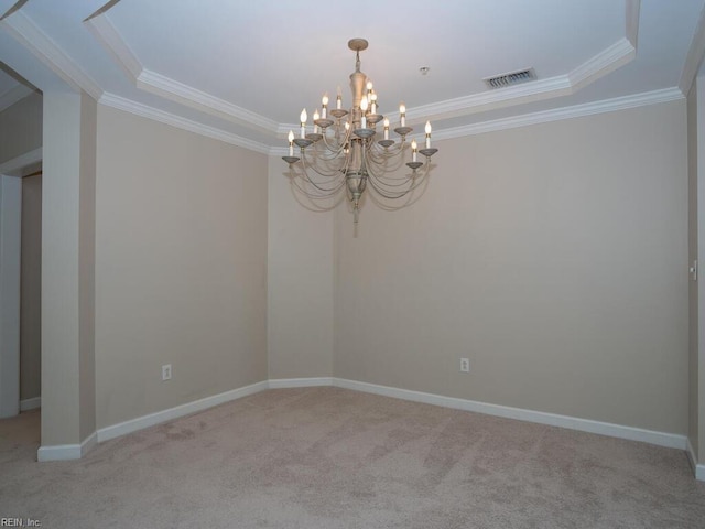 spare room featuring light colored carpet, visible vents, an inviting chandelier, ornamental molding, and baseboards