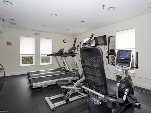 exercise room with baseboards