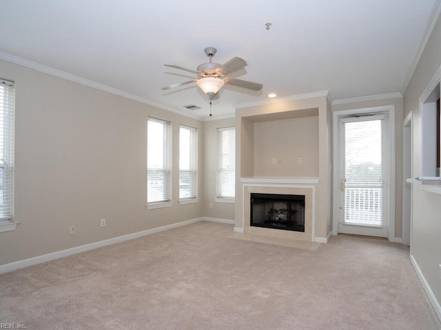 unfurnished living room with light colored carpet, a fireplace with flush hearth, visible vents, and crown molding