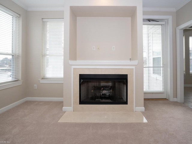 details featuring a tile fireplace, carpet flooring, and crown molding