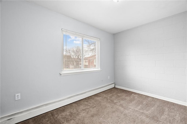 empty room featuring a baseboard heating unit and light carpet