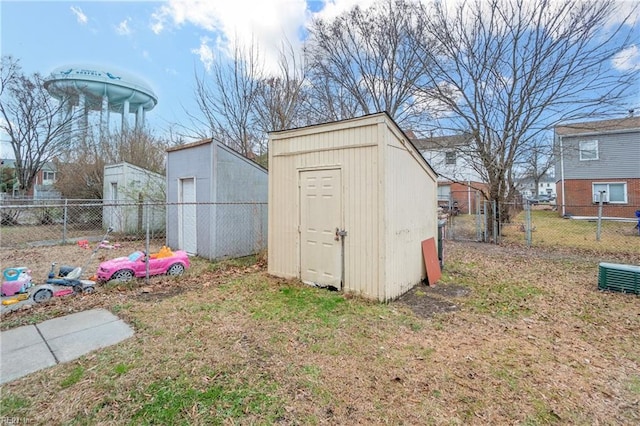 view of shed featuring fence