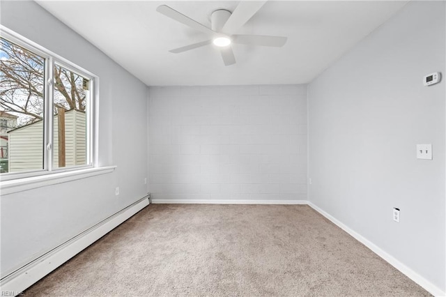 spare room with carpet floors, ceiling fan, baseboards, and baseboard heating