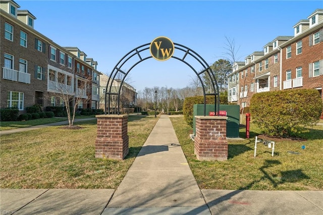 view of community featuring a residential view and a yard