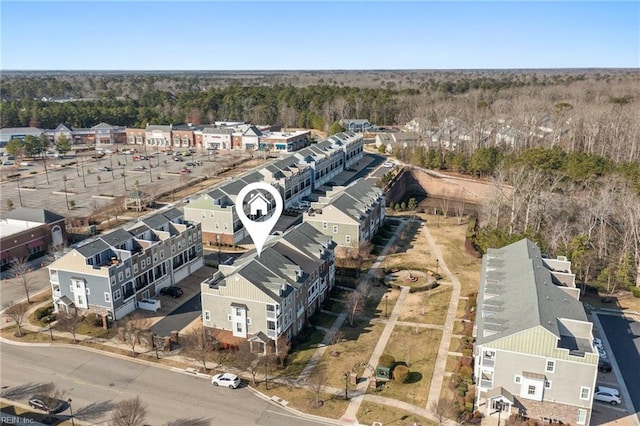 birds eye view of property with a residential view