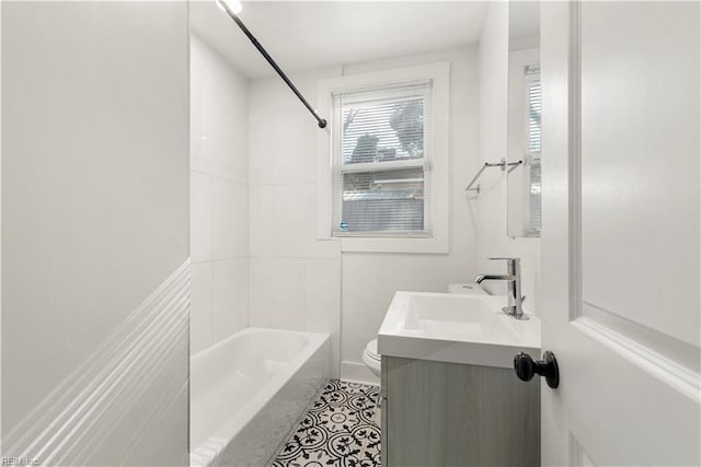 bathroom with toilet, bathing tub / shower combination, tile patterned flooring, and vanity