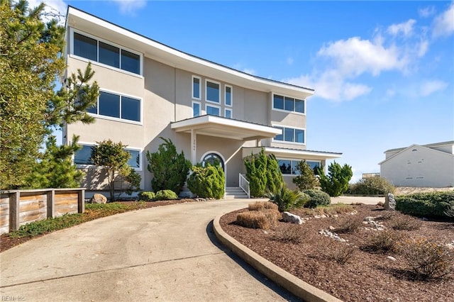 view of front of property featuring driveway and stucco siding