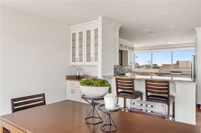 dining room with recessed lighting