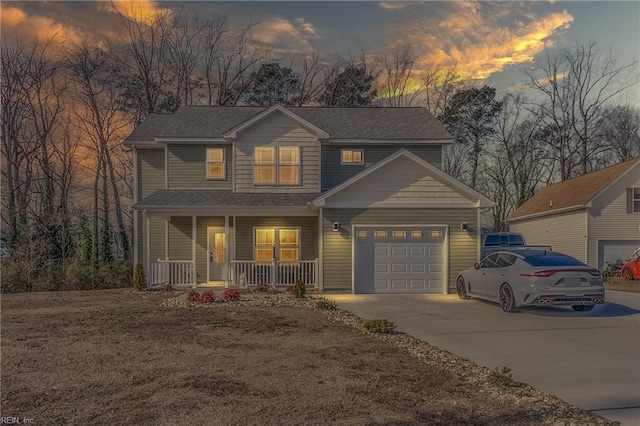 view of front of house featuring concrete driveway, a porch, and an attached garage