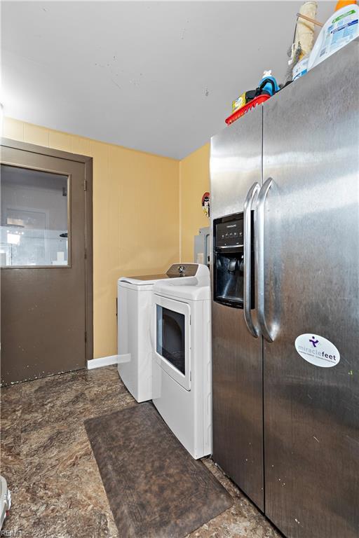 laundry area featuring laundry area and washing machine and dryer