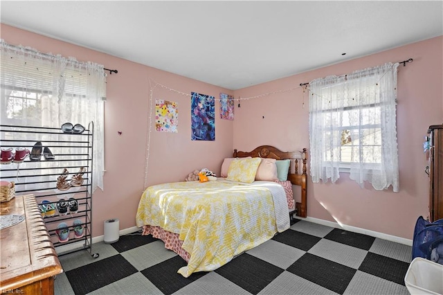 bedroom featuring baseboards