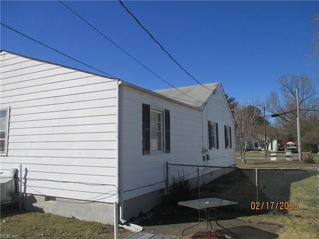 view of home's exterior featuring crawl space and fence