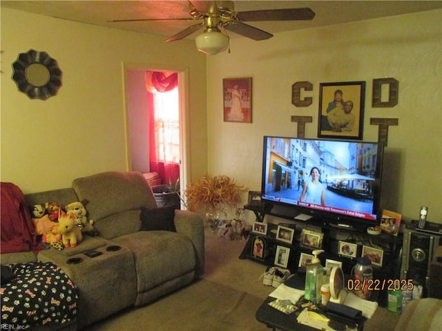 living area with carpet flooring and a ceiling fan