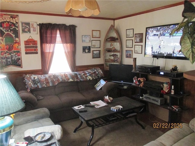 living area featuring ornamental molding and ceiling fan