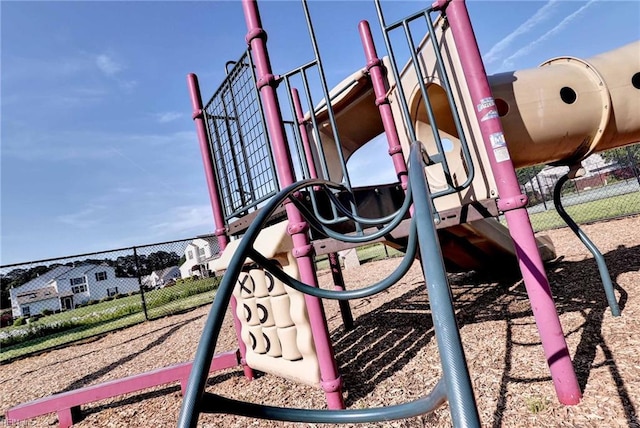 community jungle gym featuring fence