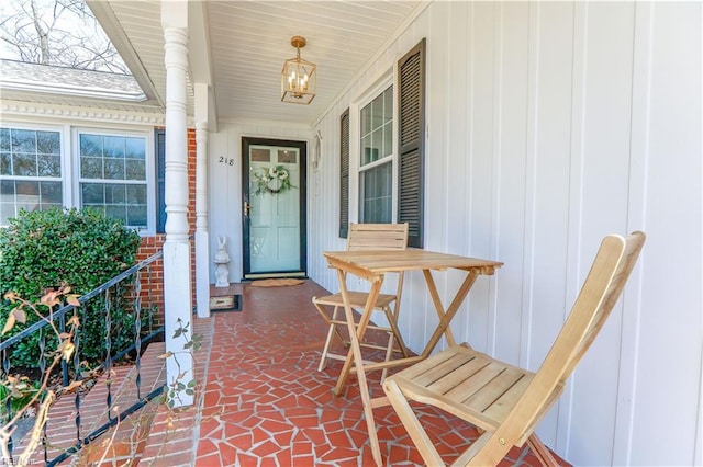 property entrance featuring brick siding