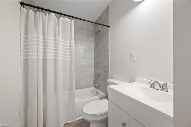 full bathroom with shower / bath combo, vanity, and toilet