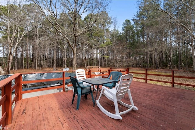 wooden deck with outdoor dining area