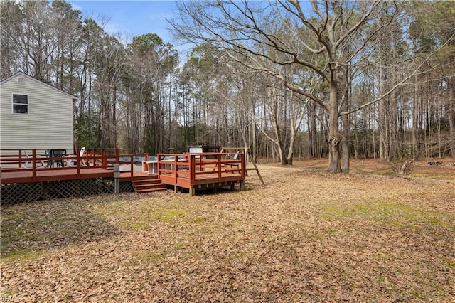 view of yard with a wooden deck